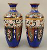 Large pair of cloisonne enamel baluster vases, Japan, Meiji 19th century, decorated in archaic manner depicting inverted blades and stylized phoenixes