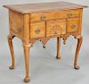 Queen Anne cherry lowboy, having rectangular top with compass star inlay over one long drawer over three short drawers, having central drawer with con