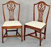 Pair of Federal cherry side chairs, with pierced carved backs, slip seats set on square tapered legs. height 39 1/2 inches, length 16 3/4 inches.
