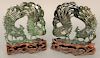 Pair of spinach green jade bird groups, each having crested male and female peacocks standing on carved rock base mounted on carved hardwood stand, Pa