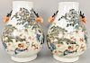 Large pair of Hu vases, China, decorated with applied deer handles and famille verte landscape scenes of a “thousand” deer and pine trees, base marked