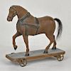 Carved and painted horse pull toy, 9 1/2'' h, 9 3/
