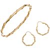 A yellow gold 14 K bracelet and hoops set.
