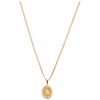 A yellow gold 18 K necklace and medal.