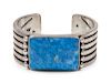 Orville Tsinnie
(Dine, b. 1943)
Sterling silver cuff bracelet with Lapis cabochon