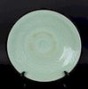 An Incised Celadon Glazed Charger.