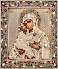 A RUSSIAN ICON OF THE VLADIMIRSKAYA MOTHER OF GOD WITH GILT SILVER, SEED PEARL AND ENAMEL OKLAD, WORKMASTER ANDREY POSTNIKOV, MOSCOW, 1883 