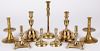 Four pairs of reproduction brass candlesticks