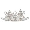 TEA AND COFFEE SET. MEXICO, 20TH CENTURY. Sterling 0.925 Silver. Smooth design with pressed edges. Decored with vegetal motifs. 5,602.3 g. Six pieces.