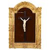 CHRIST ON THE CROSS. FRANCE, 19TH CENTURY. Ivory carving on ebonized wood cross. With red velvet bottom and carved and gilded wooden frame, decorated 
