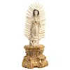 OUR LADY OF GUADALUPE. SPANISH-PHILIPPINE, 20TH CENTURY. Ivory carving with gilded and inked details. With carved and gilded wooden base, with decorat