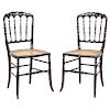 A PAIR OF CHAIRS. ENGLAND, CIRCA 1900. VICTORIAN Style. Ebonized wood with mother of pearl incrustations and hand painted details.