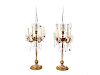 A Pair of Four-Light Gilt Metal and Crystal Four-Light Candelabra
Height 33 1/2 inches.