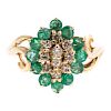 A Ladies Emerald and Diamond Cluster Ring in 14K