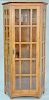 Stickley oak corner cabinet with four glass shelves. ht. 79 in.
