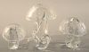 Four piece Steuben group to include set of three crystal Steuben mushrooms, smooth capped, three sizes (tallest ht. 8 in.) along with a small snail (h
