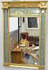 Federal style gilt mirror with three eglomise panels. 45" x 32"