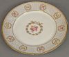 Set of twelve Limoge service plates, sold by Gilman Collamore.