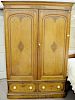 Large pine armoire, doors over two drawers, stencil decoration. ht. 82 in., wd. 51 in.