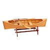 Mesa de centro. Siglo XX. Diseño a manera de canoa. En talla de madera. Con cubierta de cristal, remos y base. 30 x 151 x 58 cm.