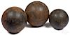 Three cast iron cannon balls