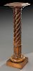 Spiral turned and fluted wooden display pedestal.