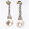A PAIR OF NATURAL SALTWATER PEARL AND DIAMOND EARRINGS, the