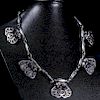 AN EARLY GEORG JENSEN SILVER NECKLACE, the five moulded mou