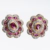 A PAIR OF RUBY AND DIAMOND CLUSTER EARRINGS, the central ov