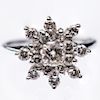 A 14CT WHITE GOLD AND DIAMOND CLUSTER RING, the seventeen g