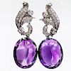 A PAIR OF ART DECO AMETHYST AND DIAMOND EARRINGS, the scrol