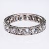 A DIAMOND ETERNITY RING, set to the entirety with brilliant
