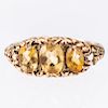 A 9CT YELLOW GOLD CITRINE RING, the three oval cut citrines