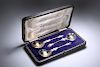AN EDWARDIAN CASED SET OF TWO SILVER-PLATED APOSTLE FRUIT S