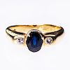 AN 18CT YELLOW GOLD SAPPHIRE AND DIAMOND RING, the oval sap