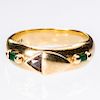AN 18CT YELLOW GOLD EMERALD AND DIAMOND RING, the unusual t