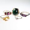 FOUR 9CT YELLOW GOLD AND GEM SET RINGS, to include garnet (