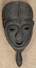 Carved and ebonized tribal mask, 20th c., 20'' h.