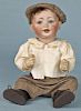 Bisque boy doll, inscribed 152/6, with a compos