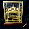 CONGREVE BRASS ROLLING BALL CLOCK IN GLASS WITH KEY