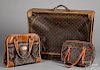 Louis Vuitton suitcase, together with two bags