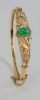 14 Karat Gold Bangle Bracelet Leaf Motif, mounted with six small diamonds and center oval jade. 15.9 grams.