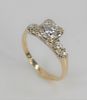 14 Karat Gold Ring Set, with center diamond approximately one carat flanked by two diamonds on either side, size 7.