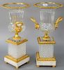 Pair of French Bronze Dore and Crystal Urns, having flared top with bronze mounted rim, gilt bronze mask handles on bronze socle, resting on bronze mo