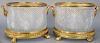 Pair of Crystal Round Urns, mounted with bronze rim and handles on bronze base with claw feet. height 10 3/4 inches, diameter 13 1/2 inches.