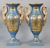 Pair of French Porcelain Vases, Chinoiserie decorated having large swann handles, celeste blue ground with gilt gold painted Oriental scenes. height 1