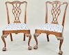 Pair of Charles Post Custom Mahogany Chippendale Style Dining Chairs, having carved crest over pierced splat with leaf carved seat rail all set on car