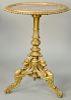 French Carved and Giltwood Circular Marble Top Stand, with a pierced mottled rouge marble top vigorously carved tripartite pedestal on winged griffin 