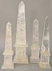 Set of Four Rock Crystal Obelisks, one clear crystal raised on sphere and mounted on rectangular base, pair neoclassical style (repaired), and large o