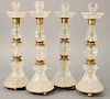 Set of Four Rock Crystal Candlesticks, neoclassical taste, polished shaped stems, brass mounts. height 14 1/2 inches.